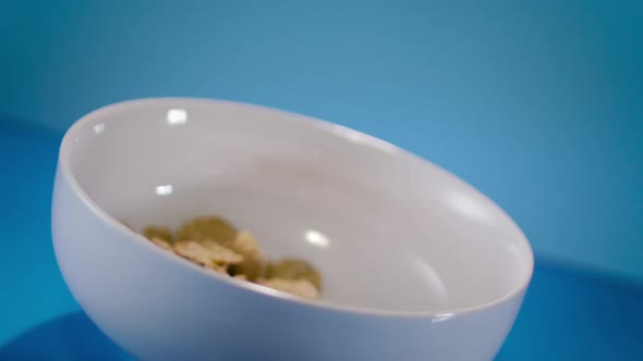 Corn Flakes Cereal Pouring In A Bowl