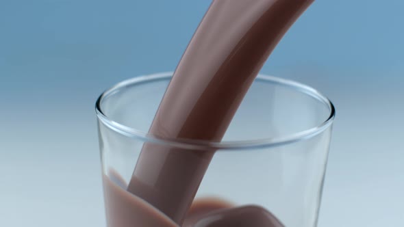 Chocolate milk pouring and splashing in slow motion; shot on Phantom Flex 4K at 1000 fps