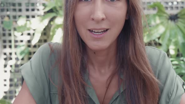 Young Woman Talking on Camera Outdoors