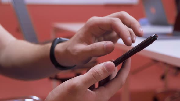 close-up video of businessman's hands surfing the internet with smart phone