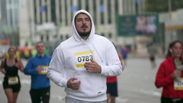 Male Sportsman with Fat Body Build on Marathon Running Event Among Athletes