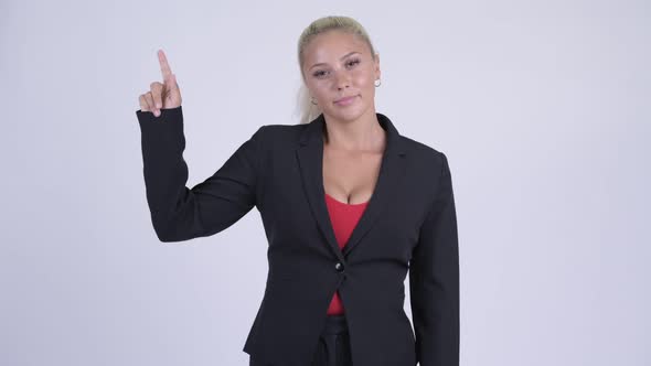 Young Happy Blonde Businesswoman Pointing Up