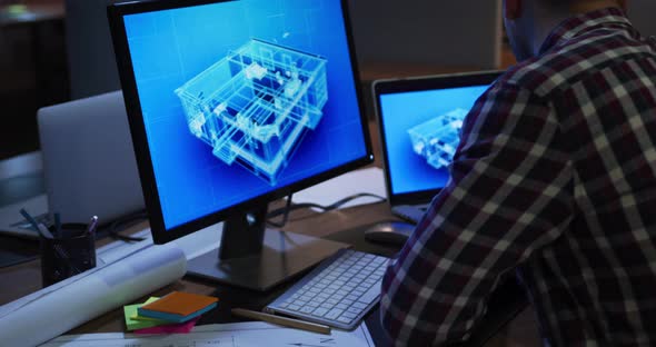 Businessman working in a modern office by night