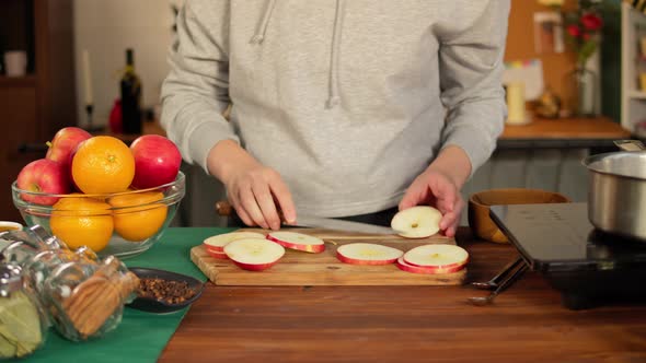 Woman Cutting Red Aplles Closeup