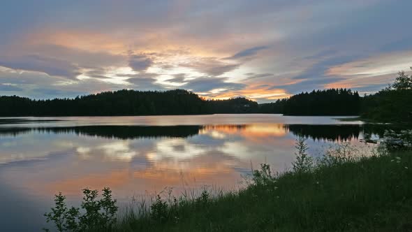 A Sunset Over a Body of Water