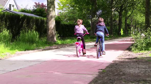 Kids biking on bike path