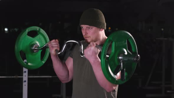 Man with Big Biceps in Training