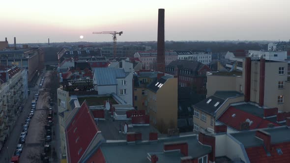 AERIAL: Flight Over Beautiful Berlin Neighbourhood Rooftop Cityscape During Sunset 