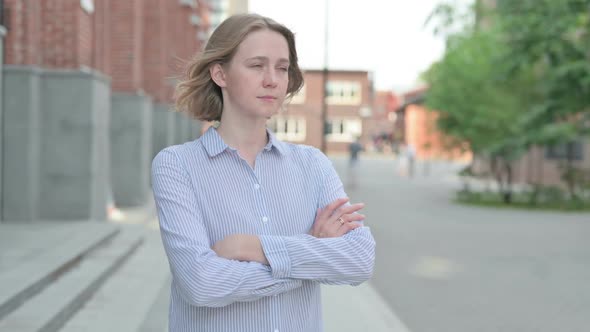 Woman Thinking While Standing Outside