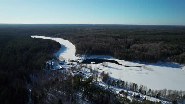 Nature of Russia  Flyover of River and Pine Trees Covered with Snow