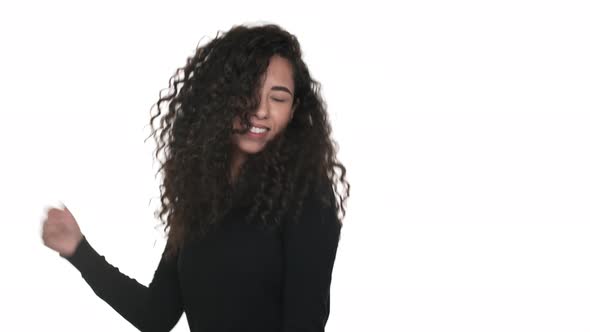 Portrait of Attractive Woman 20s Dancing Smiling Having Pleasure Over White Background