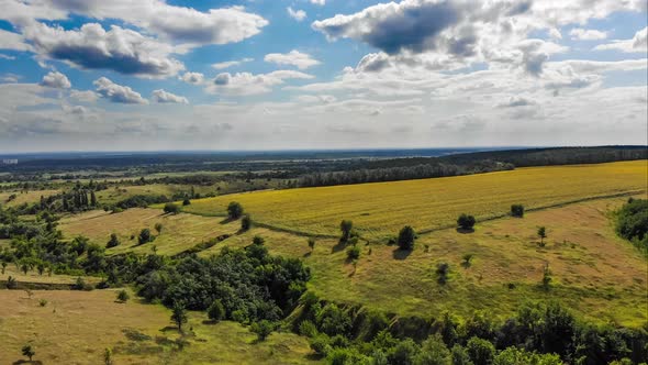 Hyperlapse of Village and Small Houses with Moving Clouds in Sky From a Flying Drone