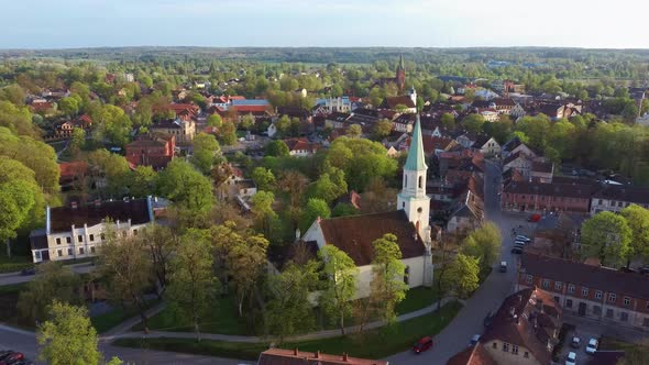 Kuldiga Old Town With Red Roof Tiles and Evangelical Lutheran Church of Saint Catherine in Latvia