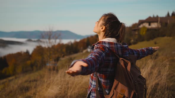 Slow Motion Portrait Young Woman in Chekered Jacket Raising Her Arms Into Blue Sky and Enjoying View