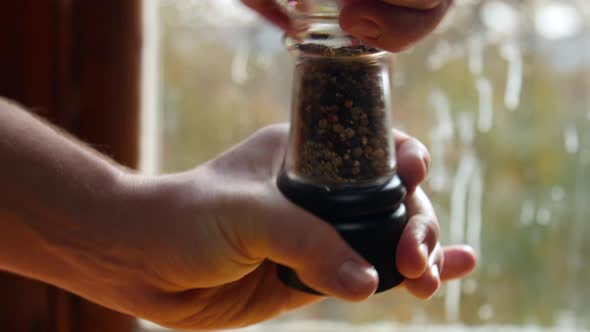 Hand Grinding Pepper From A Shaker