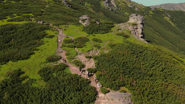 Four Tourists Climb Up in the Summer