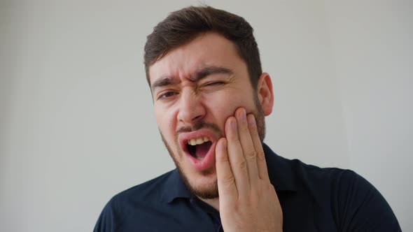 Handsome Bearded Man Suffering From Toothache