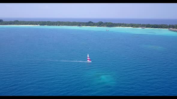 Aerial flying over panorama of paradise bay beach vacation by aqua blue lagoon and white sandy backg