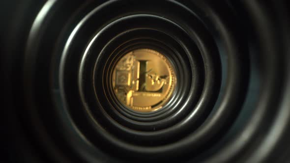 Wide-angle Macro View Golden Litecoin Coins in Dark Tunnel on Reflective Black Glass Surface