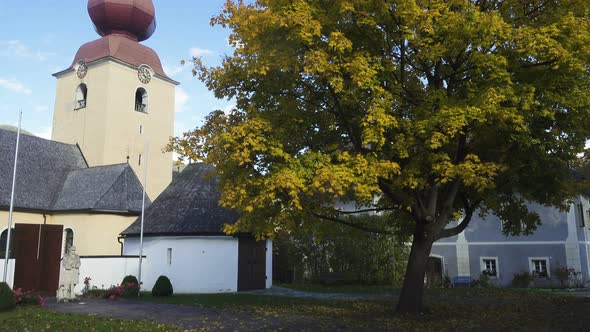 Churh And Traditional Buildings Of The Small Austrian Village