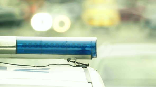 Flashing Flasher on the Roof of a Police Car. Blinker. Close-up.