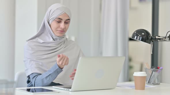 Young Arab Woman with Laptop Having Wrist Pain