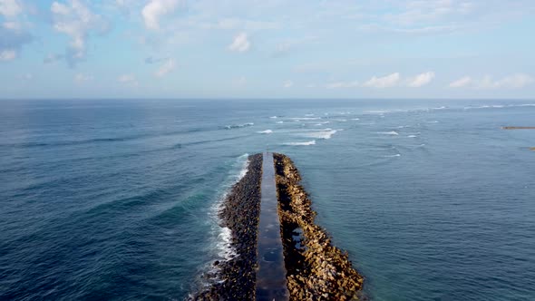 Aerial View on Breakwater a Far From the Beach