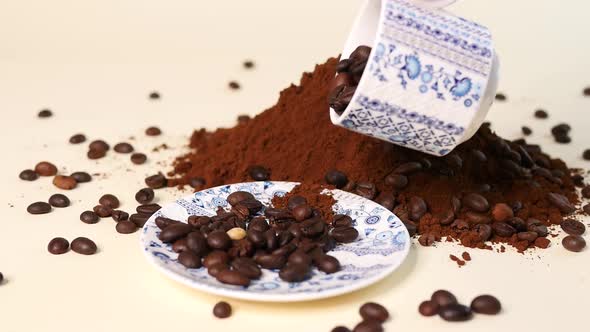 Coffee beans background. Coffee beans pour out of the cup. Ground and whole grain coffee.
