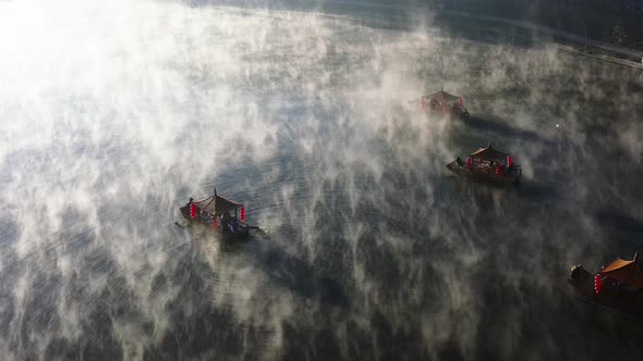 Aerial View of Sunrise with Fog Over Ban Rak Thai Chinese Village Near a Lake in Mae Hong Son