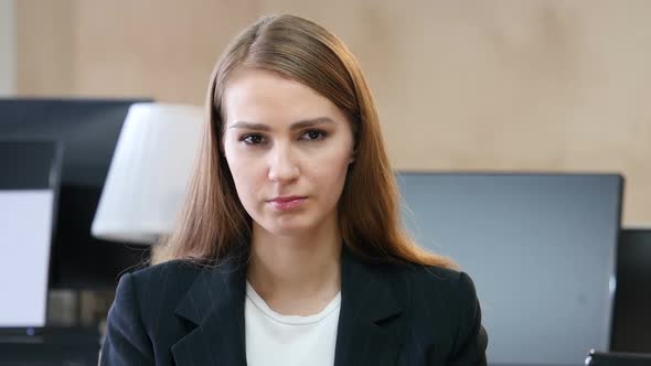 Portrait of Upset Sad Woman in Office