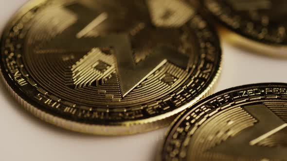 Rotating shot of Bitcoins (digital cryptocurrency) - BITCOIN MONERO 