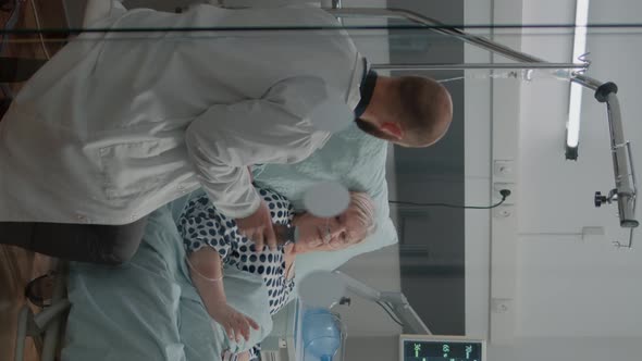 Vertical Video Doctor Giving Bottle of Pills for Old Patient with Illness