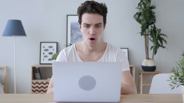 Shocked Stunned Man Working on Laptop