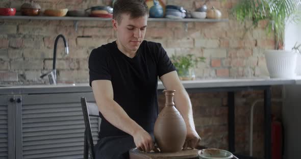 Close Up View Potter Separates the Molded Nerikomi Pot From the Potter's Wheel Pottery Workshop