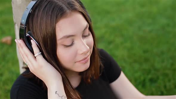 KYIV UKRAINE  JUNE19 2020  Mixed Race Teenage Girl Listening to Music