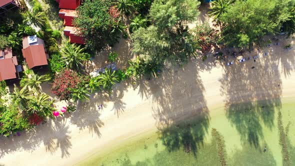 Beautiful birds eye copy space shot of a white sand paradise beach and aqua blue ocean background in