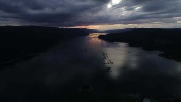 Beautiful Sunset with Dark Clouds and Silhouette of Mountains