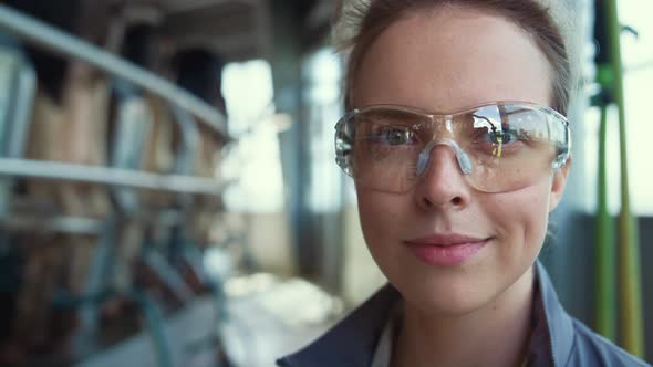 Portrait Dairy Worker Posing at Milk Farm Production Facility in Glasses Alone