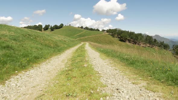 Crane Up Near Road in Mountain Outdoor Nature Scenery During Sunny Summer Day Establishing Gimbal