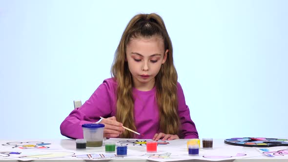 Children Paint a Picture with Pencils and Admire Their Work. Close Up. White Background. Time Lapse