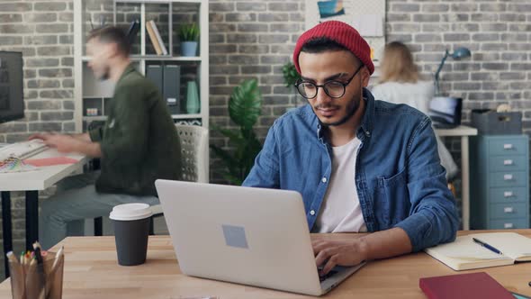 Time-lapse of Busy Young Man Using Computer in Office Focused on Project