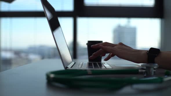Closeup Hands of Unrecognizable Female Physician in Medical Uniform Working Typing on Laptop
