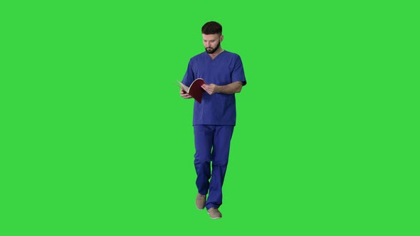 Doctor Reading Medical Journal While Walking on a Green Screen, Chroma Key.