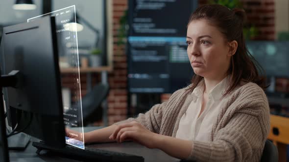 Caucasian System Engineer Working Focused Looking at Vfx of Floating Computer Screen with
