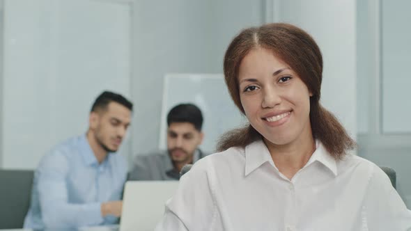 Smiling Friendly Businesswoman Looking at Camera Showing Like Thumbs Up