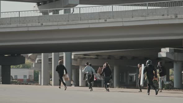 Protesters Running Away from Riot Police