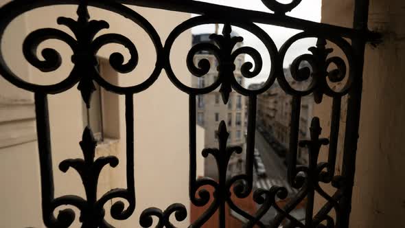 Timelapse street viewed through wrought railing Paris, France