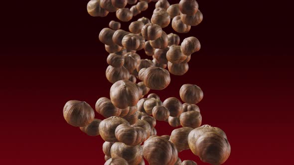 Falling of Hazelnuts in Deep Red Background