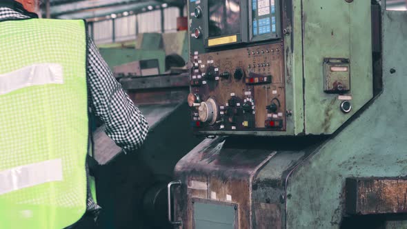 Smart Factory Worker Using Machine in Factory Workshop