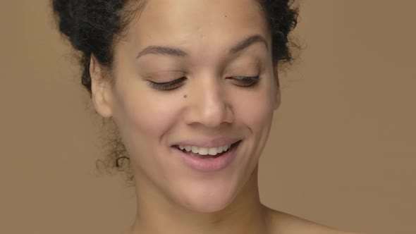 Beauty Portrait of Young African American Woman Smiling Winking and Showing Ok Sign